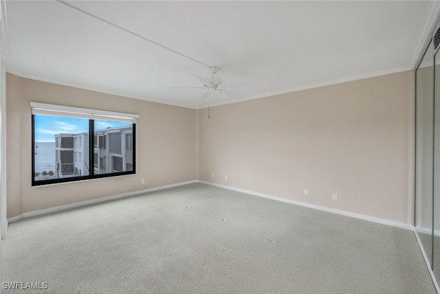 2777 W Gulf Dr Unit 309, Sanibel, FL 33957 - carpeted empty room with baseboards, a ceiling fan, and crown molding