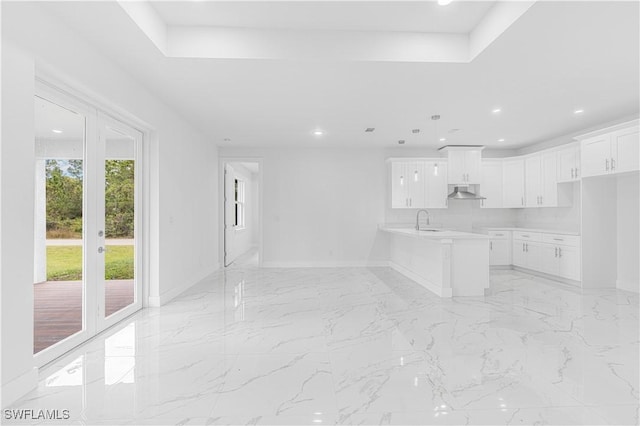 unfurnished living room with sink