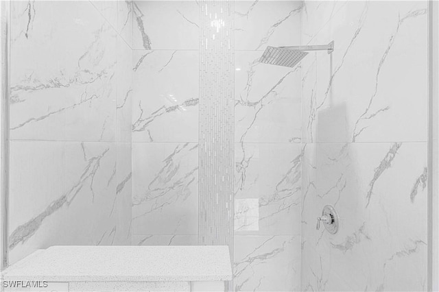 room details with a tile shower