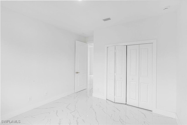 unfurnished bedroom featuring a closet