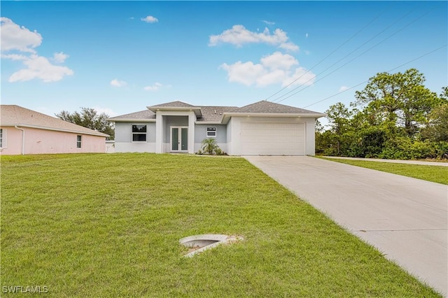 view of front facade with a front lawn and a garage