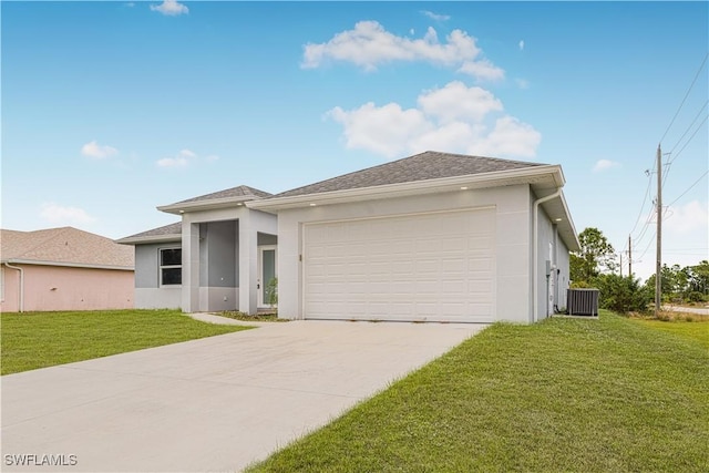 view of front facade with a front yard and a garage