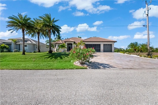 ranch-style home featuring a garage and a front lawn