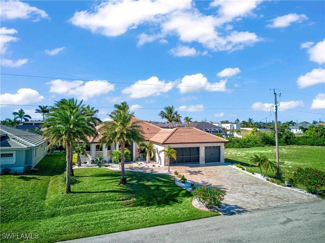 view of front of home featuring a garage and a front yard