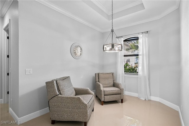 living area featuring crown molding, an inviting chandelier, and a tray ceiling