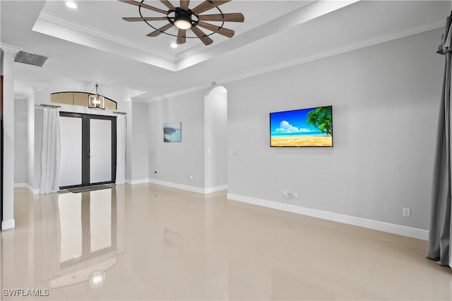 unfurnished living room featuring crown molding, a raised ceiling, and ceiling fan