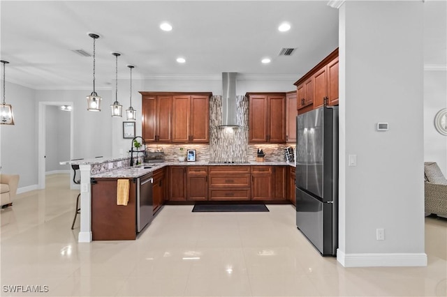 kitchen featuring wall chimney exhaust hood, a breakfast bar, decorative light fixtures, appliances with stainless steel finishes, and kitchen peninsula