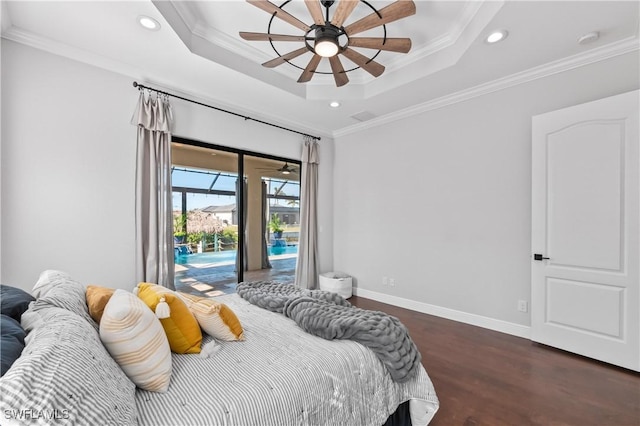 bedroom with dark wood-type flooring, access to outside, ornamental molding, a tray ceiling, and ceiling fan