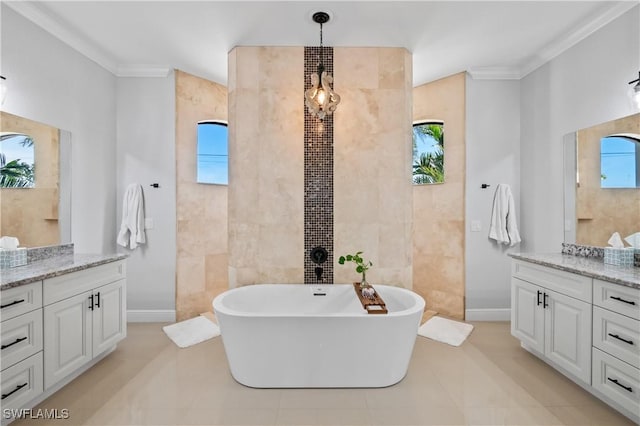 bathroom with tile walls, a tub to relax in, tile patterned flooring, vanity, and crown molding