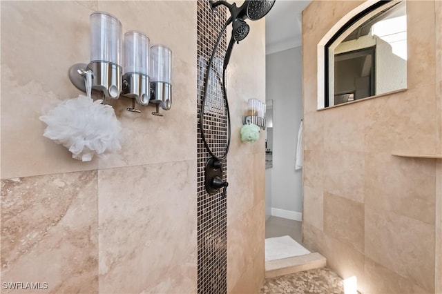 interior details featuring tiled shower