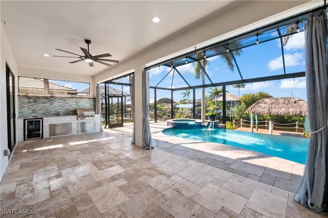 view of swimming pool featuring pool water feature, area for grilling, a lanai, an in ground hot tub, and a patio