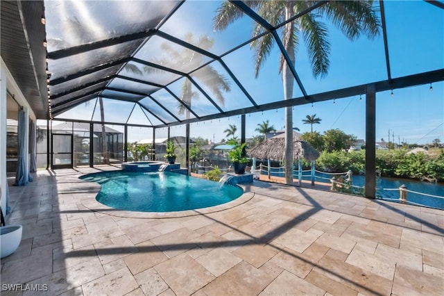 view of swimming pool featuring an in ground hot tub, a patio, and glass enclosure