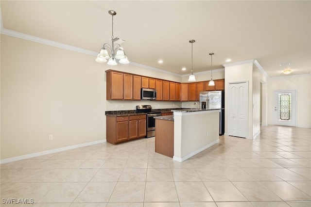 kitchen with light tile patterned floors, a kitchen island, appliances with stainless steel finishes, brown cabinetry, and crown molding