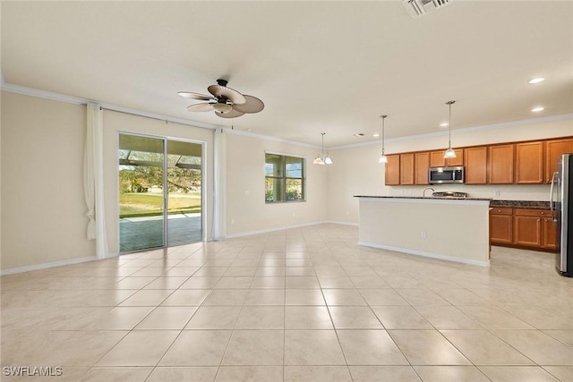 kitchen with a center island with sink, ornamental molding, appliances with stainless steel finishes, and pendant lighting