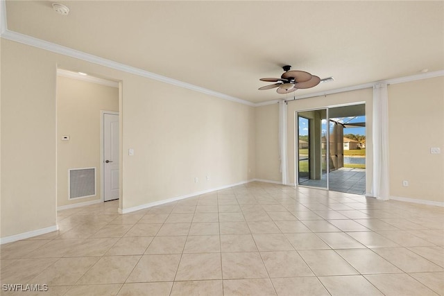 spare room with light tile patterned floors, visible vents, a ceiling fan, and ornamental molding