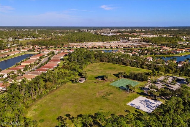 birds eye view of property with a water view and a residential view