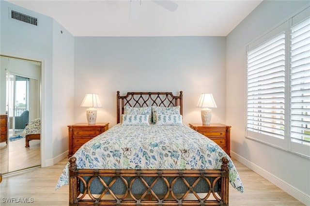 bedroom with ceiling fan and light hardwood / wood-style floors