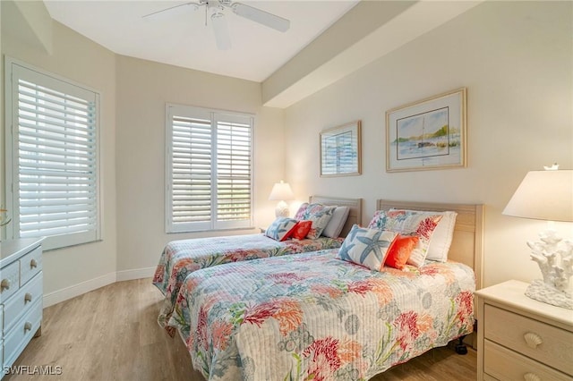 bedroom with light wood-type flooring and ceiling fan