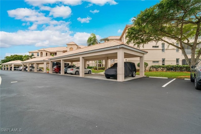 view of vehicle parking with a carport