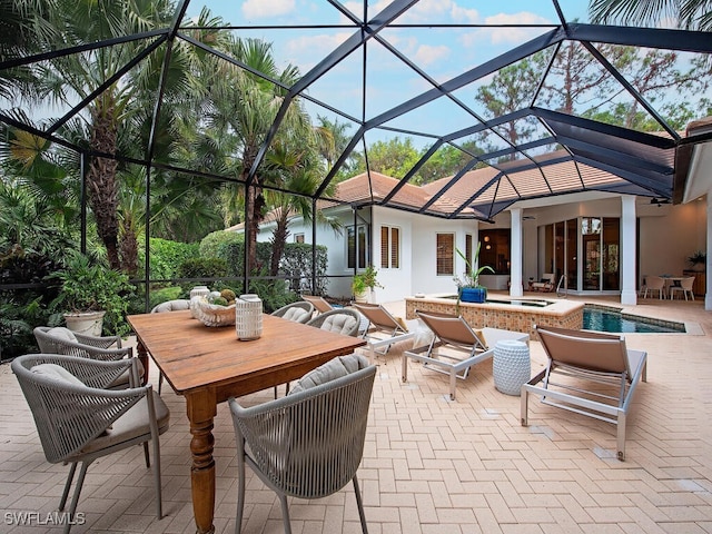 view of patio with a pool with hot tub and glass enclosure