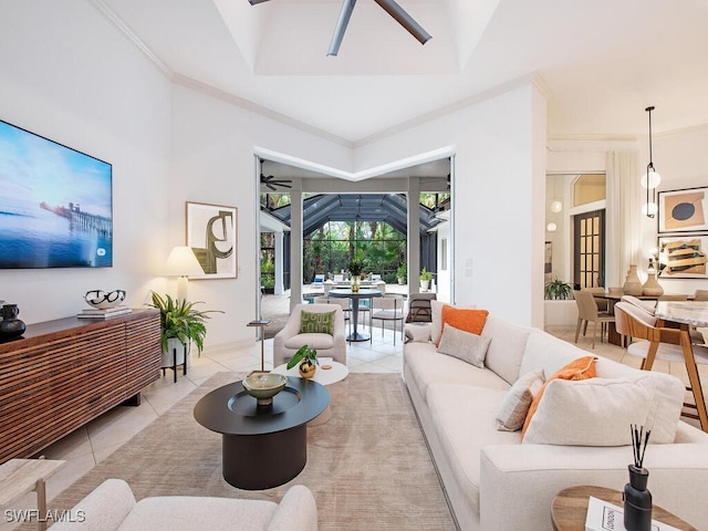 tiled living room featuring crown molding, ceiling fan, and a tray ceiling