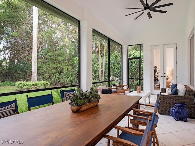 sunroom / solarium featuring ceiling fan and french doors