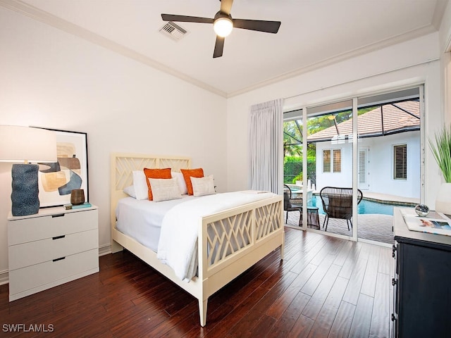 bedroom featuring ornamental molding, dark hardwood / wood-style floors, and ceiling fan