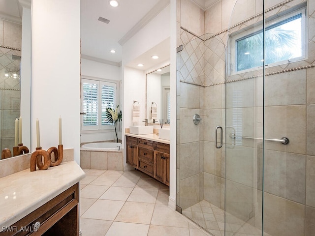 bathroom with vanity, tile patterned floors, and plus walk in shower