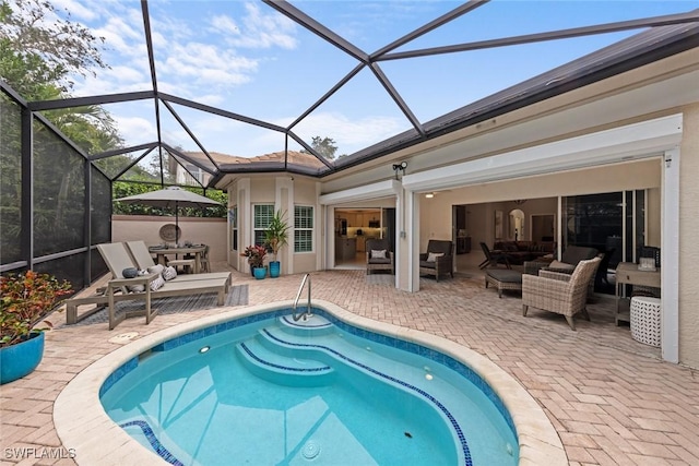 view of pool with a patio area, a lanai, and an outdoor hangout area