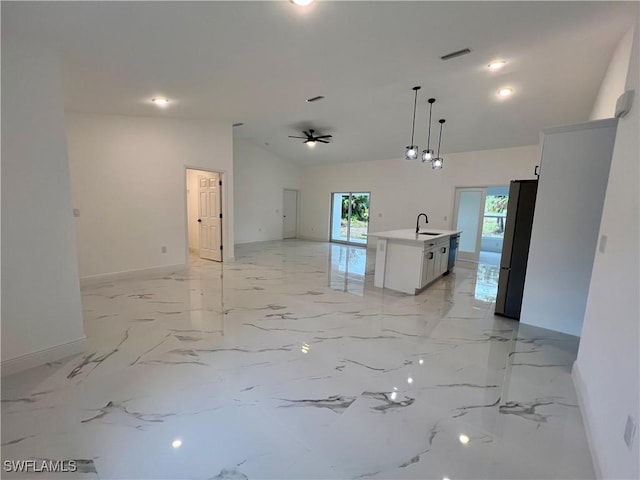 spare room with sink, ceiling fan, and high vaulted ceiling