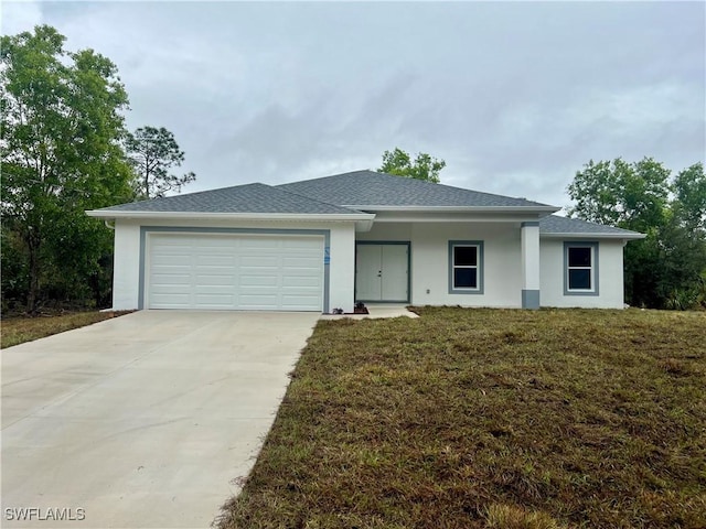 view of front facade featuring a front yard and a garage