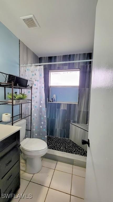 bathroom with toilet, a shower with shower curtain, tile patterned flooring, and vanity