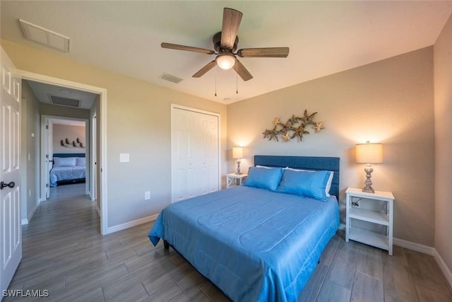 bedroom with ceiling fan and a closet