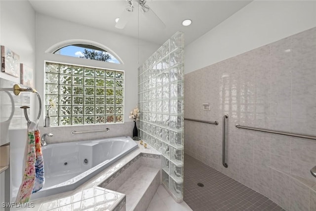 bathroom with independent shower and bath and tile patterned flooring