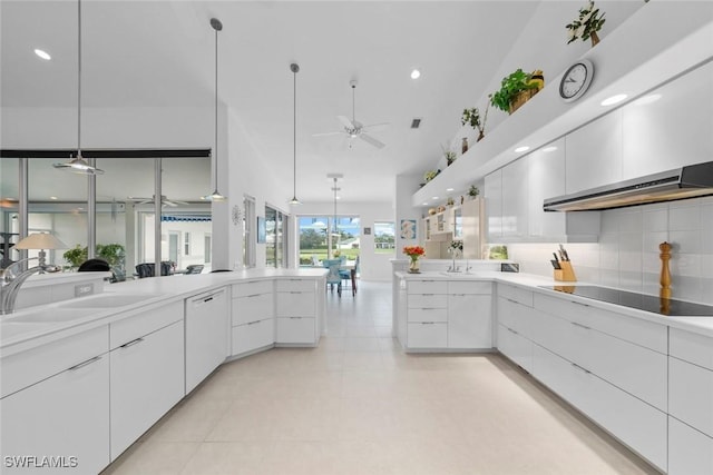 kitchen featuring decorative light fixtures, ceiling fan, dishwasher, white cabinetry, and black electric cooktop