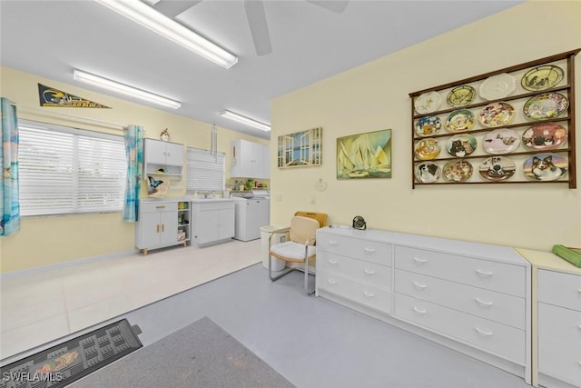 interior space featuring washing machine and clothes dryer and sink