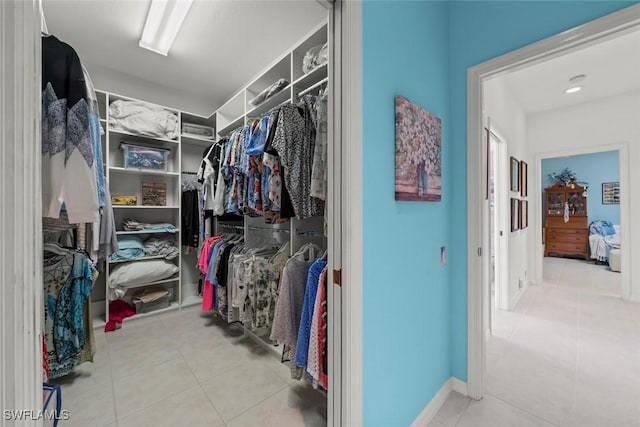 spacious closet featuring tile patterned flooring