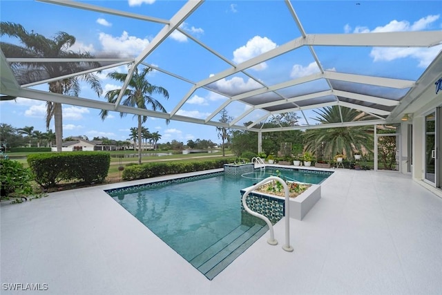 view of swimming pool featuring a lanai and a patio area