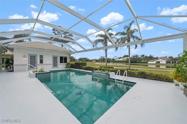 view of pool with a lanai and a patio area