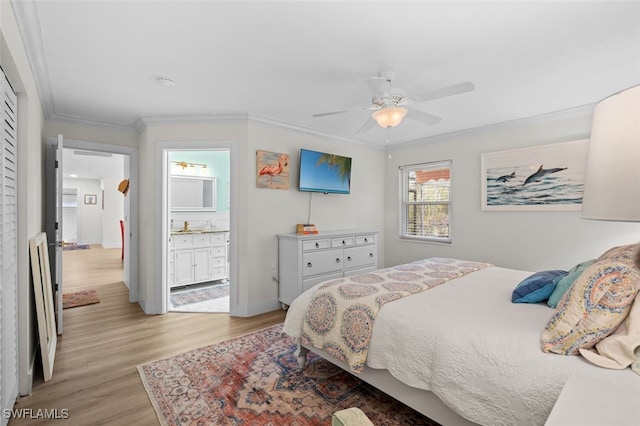 bedroom featuring ensuite bath, ornamental molding, ceiling fan, and light wood-type flooring