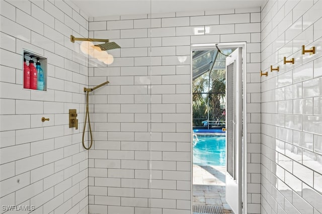 bathroom with tiled shower