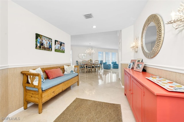 9811 Gulf Shore Dr Unit 301, Naples, FL 34108 - hallway with a chandelier and wainscoting