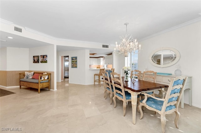 dining space featuring a notable chandelier and crown molding