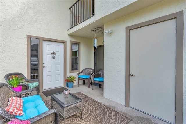 entrance to property featuring a balcony