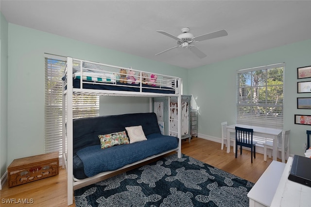 bedroom featuring hardwood / wood-style flooring and ceiling fan