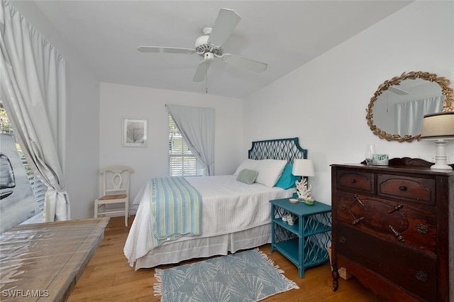 bedroom featuring light hardwood / wood-style flooring and ceiling fan