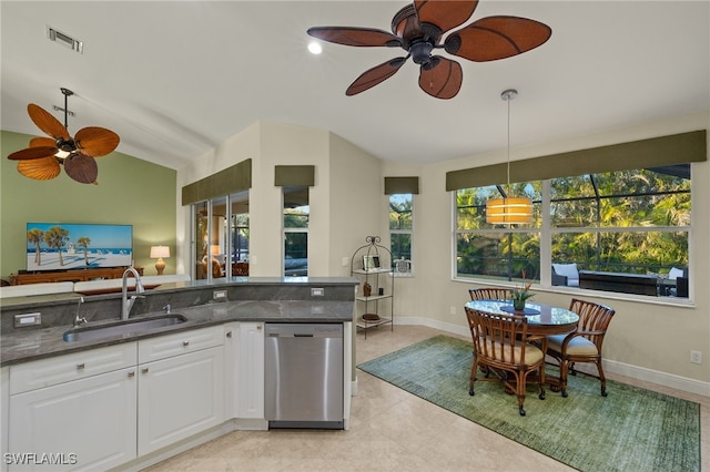 kitchen with sink, white cabinetry, hanging light fixtures, vaulted ceiling, and stainless steel dishwasher