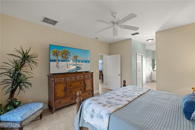 bedroom with ceiling fan and ensuite bath