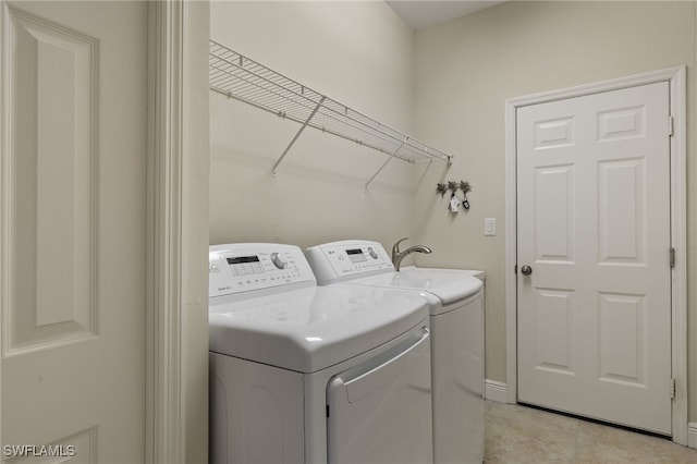 washroom with separate washer and dryer