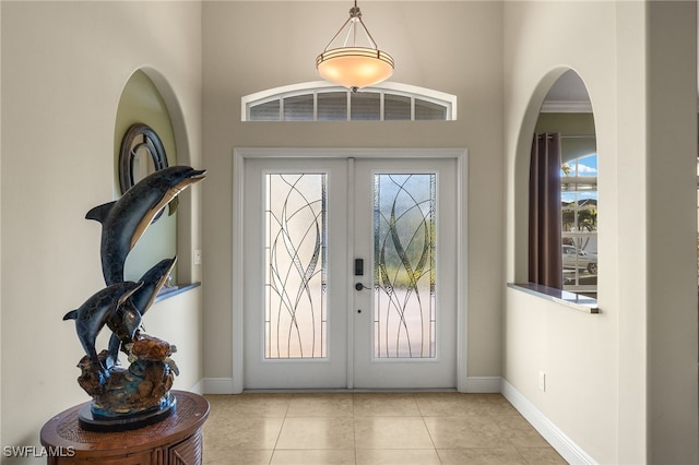 tiled entryway featuring french doors